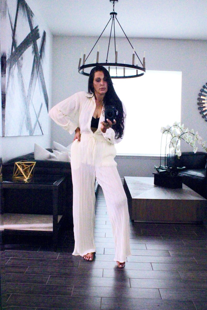 ShopJenny Boutique model is pictured wearing Audrina Pleated Plisse Pant Set - Cream made by BlueB.