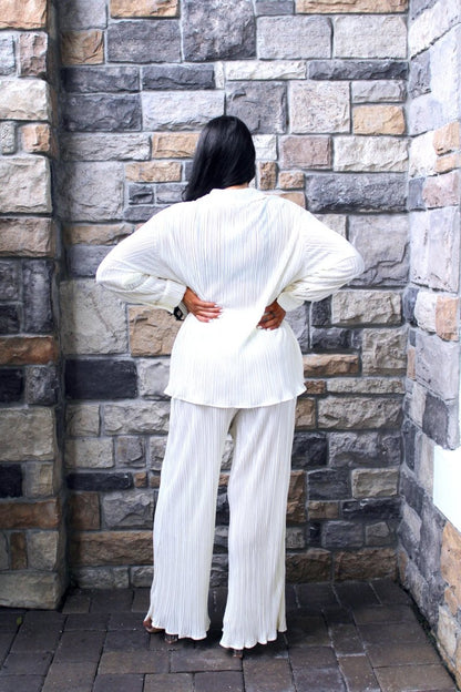 ShopJenny Boutique model is pictured wearing Audrina Pleated Plisse Pant Set - Cream made by BlueB.
