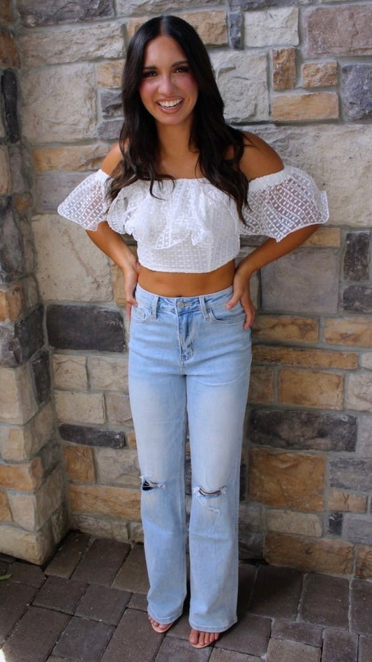 ShopJenny Boutique model is pictured wearing Becca Lace Off Shoulder Ruffle Top - White made by Do + Be Collection.