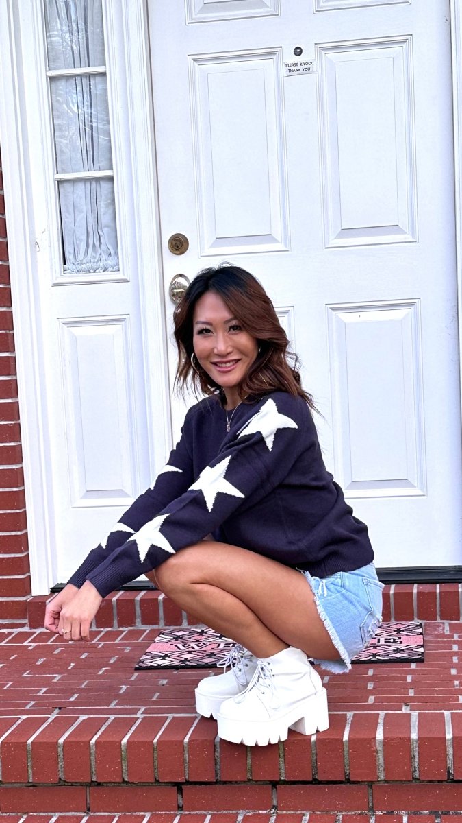 ShopJenny Boutique model is pictured wearing Hayden Star Sweater - Navy/White made by BaeVely.