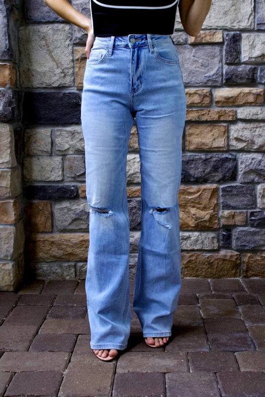 ShopJenny Boutique model is pictured wearing Laurren Vervet 90's Vintage Flare Jeans made by VERVET.