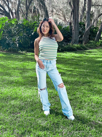 ShopJenny Boutique model is pictured wearing Sadie Striped Knit Top - Cream/Green made by Saints & Secrets.