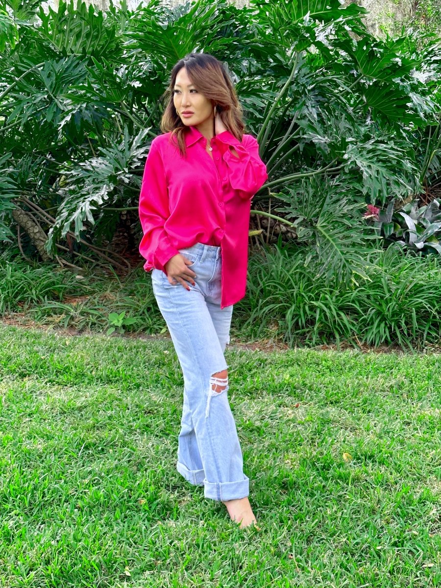 ShopJenny Boutique model is pictured wearing Savi Satin Button Down Top - Fuchsia made by Mimosa.