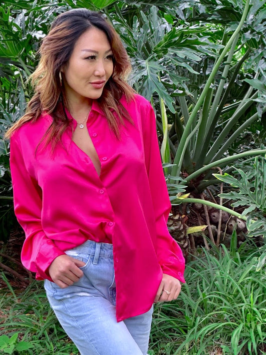 ShopJenny Boutique model is pictured wearing Savi Satin Button Down Top - Fuchsia made by Mimosa.